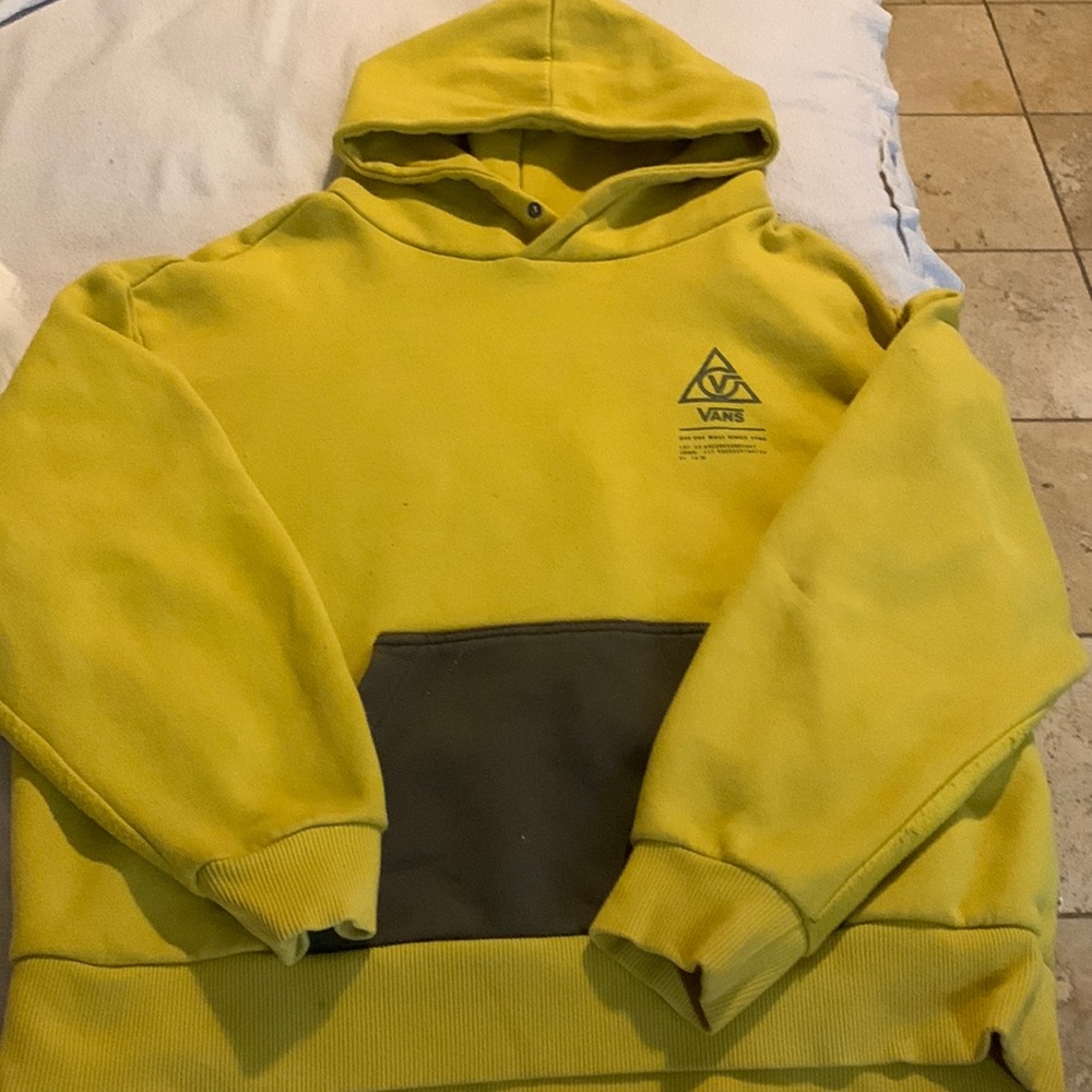yellow hoodie with a button instead of strings
